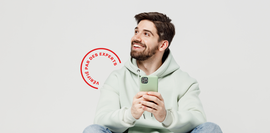 Man in light green hoodie using a phone with a red stamp-like graphic on a white background